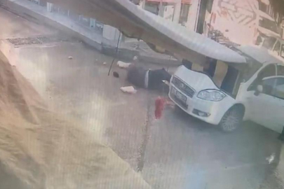 Bursa'da  alışveriş yaptıktan sonra otomobilin altında kaldı