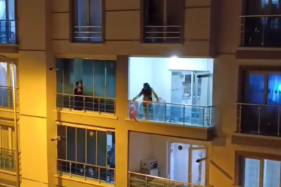Sinir krizi geçiren genç kadın balkonundaki eşyaları yola fırlattı