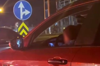 Kucağında çocukla araç kullanan sürücüye tepki yağdı